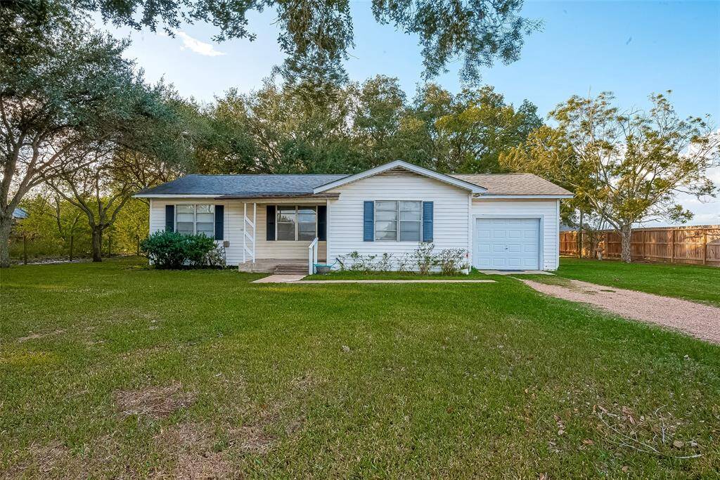 Large front yard and extended driveway