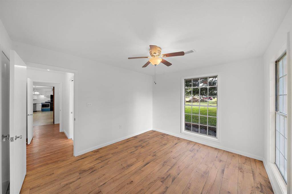 Another view of the second bedroom shows the hallway.