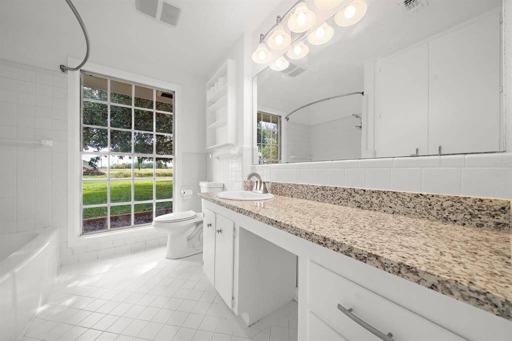 The second bath is stunning. New gleaming granite, tile, fixtures and lighting.