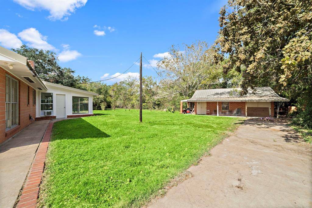 The guest house features a living area, bedroom, kitchen, and bath as well as an extra garage space. It needs work but the possibilities are endless.