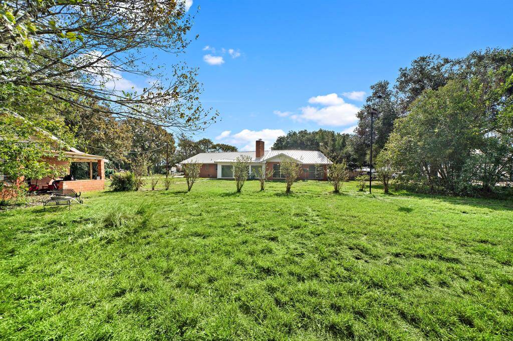 View from the back of the property line. Guest house on the left.