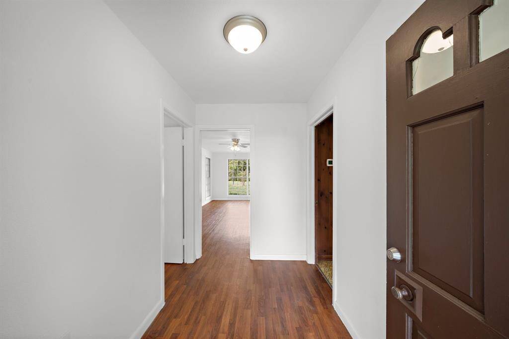 Large welcoming entry to greet your guests. Check out those beautiful floors and the neutral paint. This lovely home has been updated in a color pallet sure to please. You have found the one!