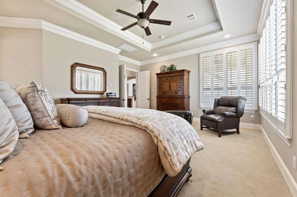 A glimpse of the elegant double doors reinforces the seamless flow of the space.