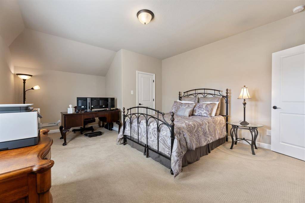 Spacious and well-lit, this bedroom offers flexibility, with enough room for a seating area or home office setup.