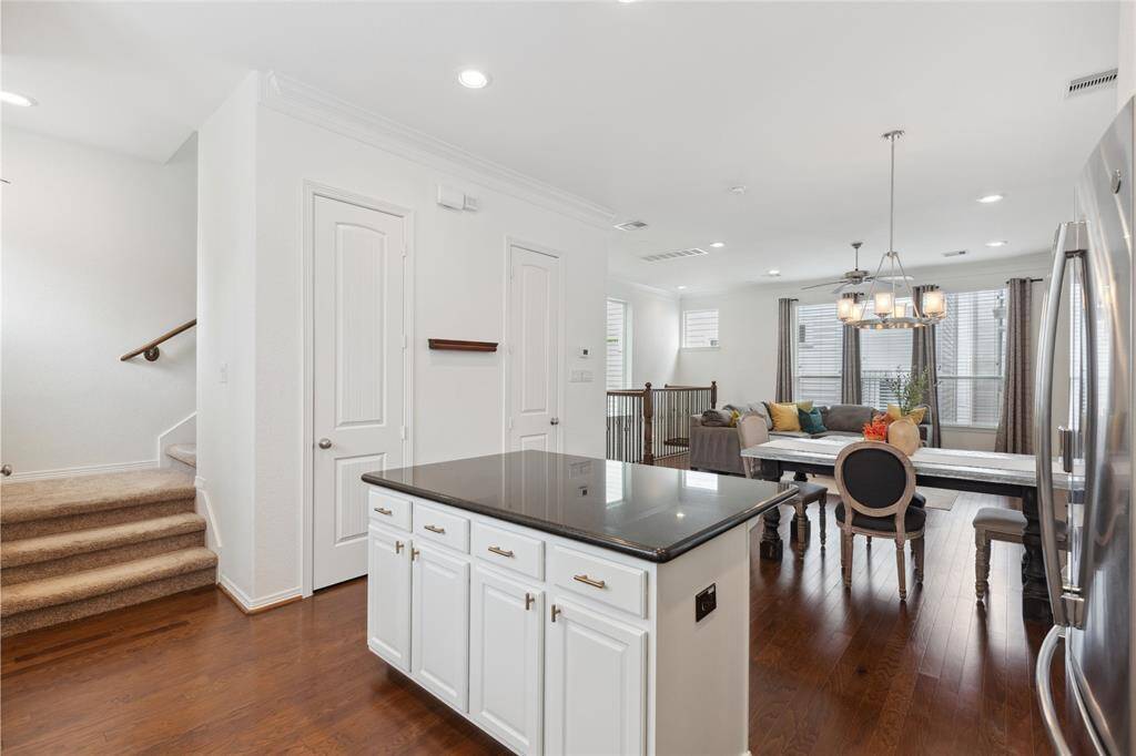 A half bathroom is found on the main living floor just off the kitchen.