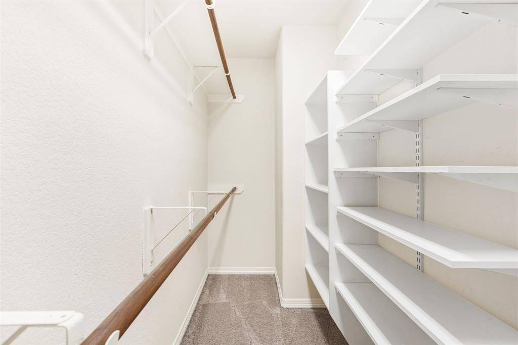 One of the two primary closets!