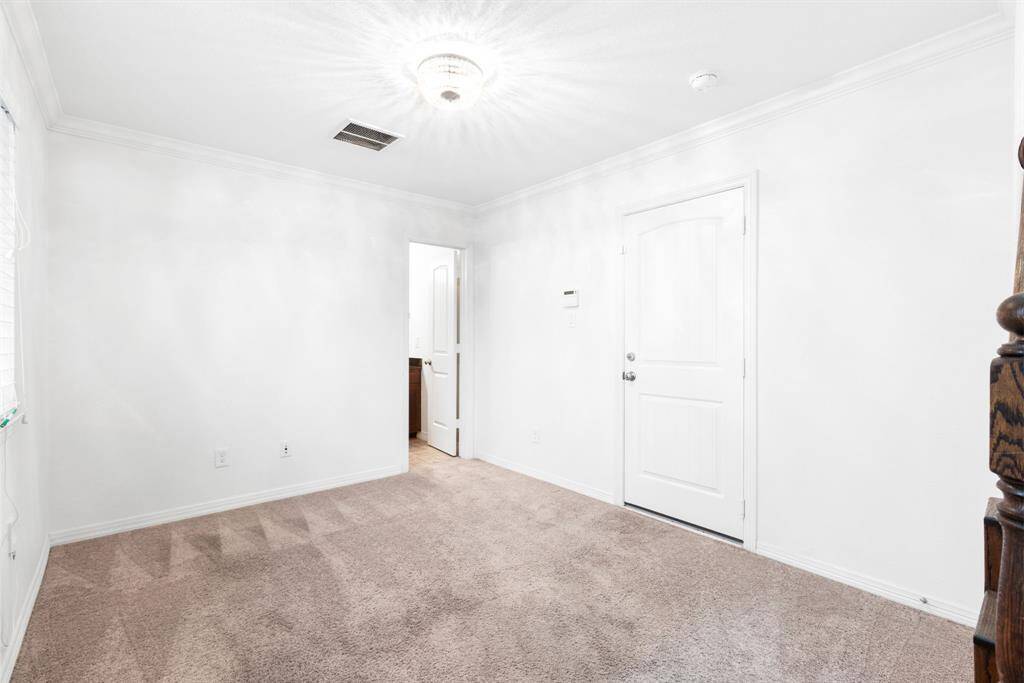 The current owners used this room as an office space. It features its own bathroom, access to the backyard and garage. It would make for a great playroom, guest room or office space.
