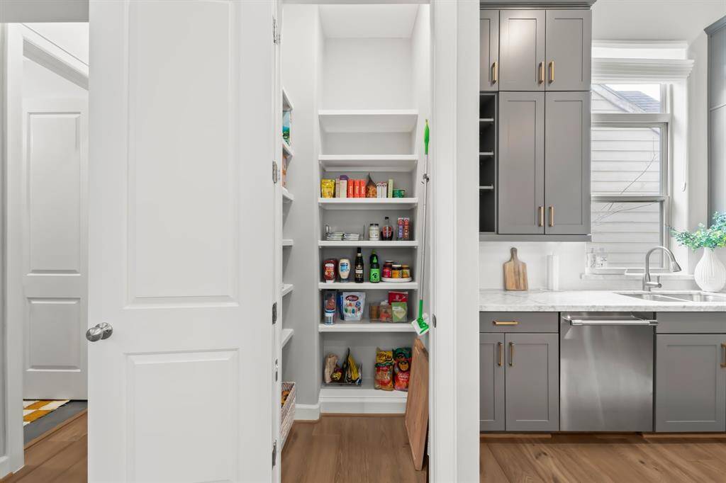 Spacious walk-in pantry for effortless organization and storage.