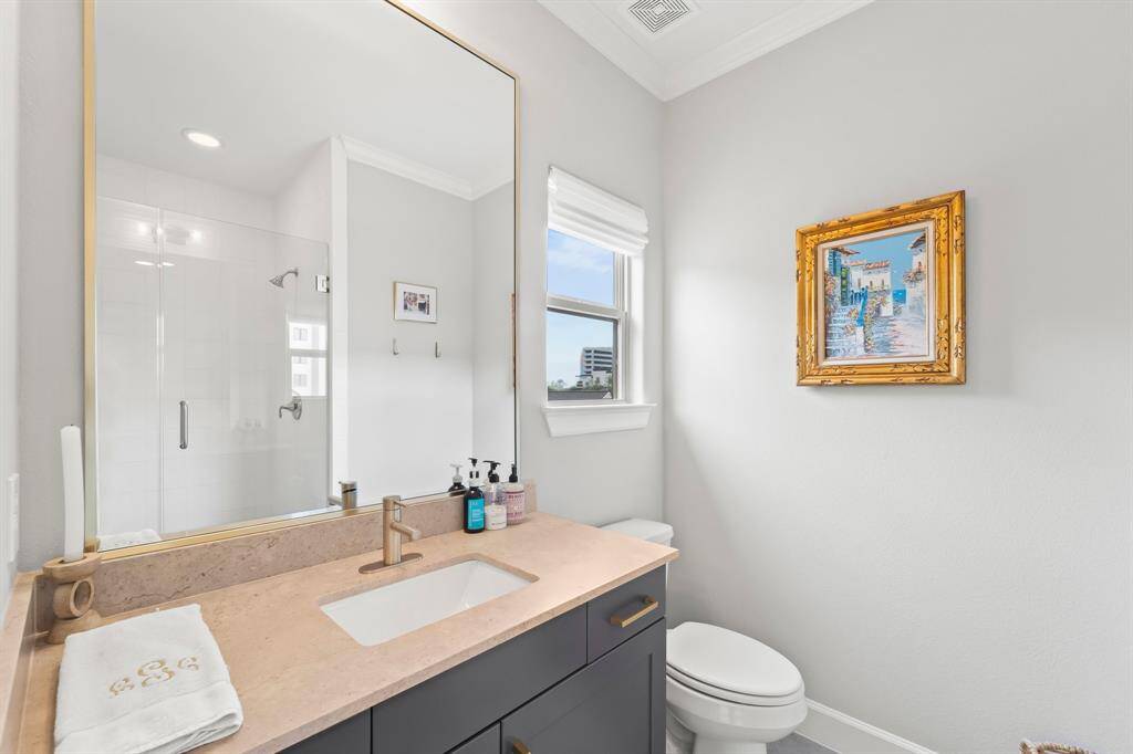 Luxurious third-floor ensuite with a sleek walk-in shower.