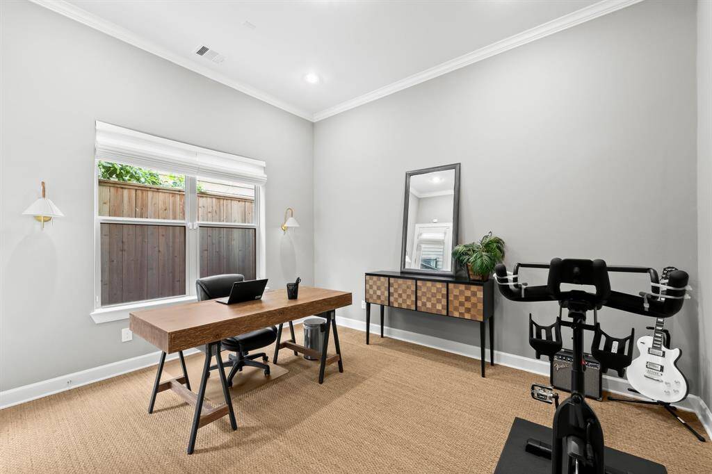 Versatile first-floor room perfect as a bedroom or home office.