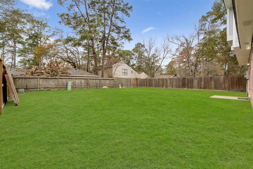 This large backyard continues and has green space for any pets, landscaping, and gardening.