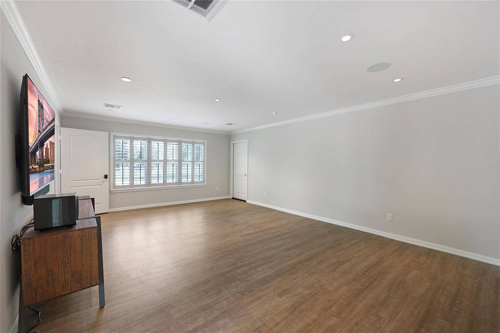 Guest suite living room leads to attached garage