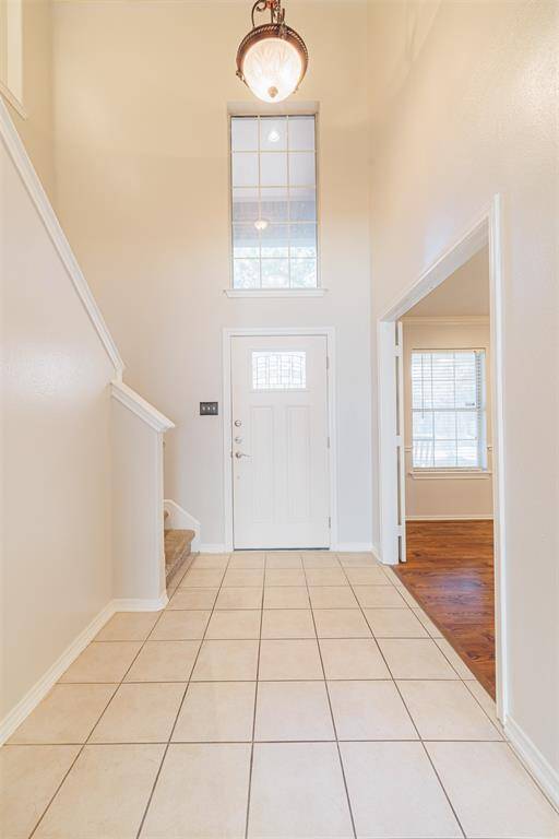 To the right, office/formal dinning, left stairs to the bedrooms and media room.