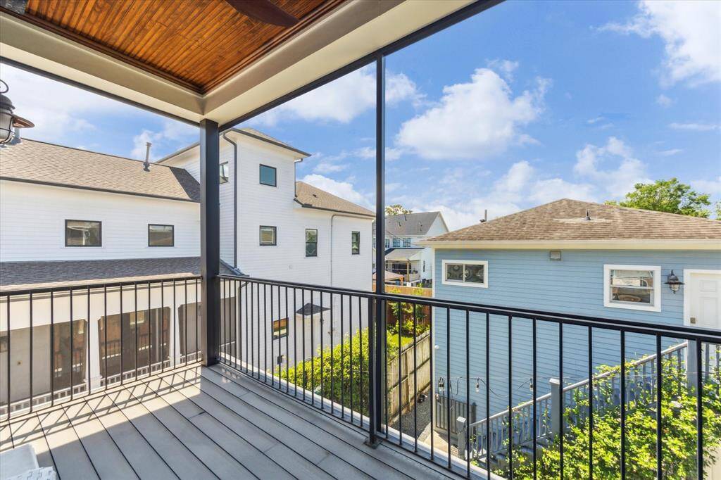 Private South-Facing Balcony: This sunlit south-facing balcony offers a peaceful escape with views over the lush backyard. Framed by sleek black railing and a warm wood ceiling, it’s an ideal spot for enjoying fresh air and sunshine in complete privacy.