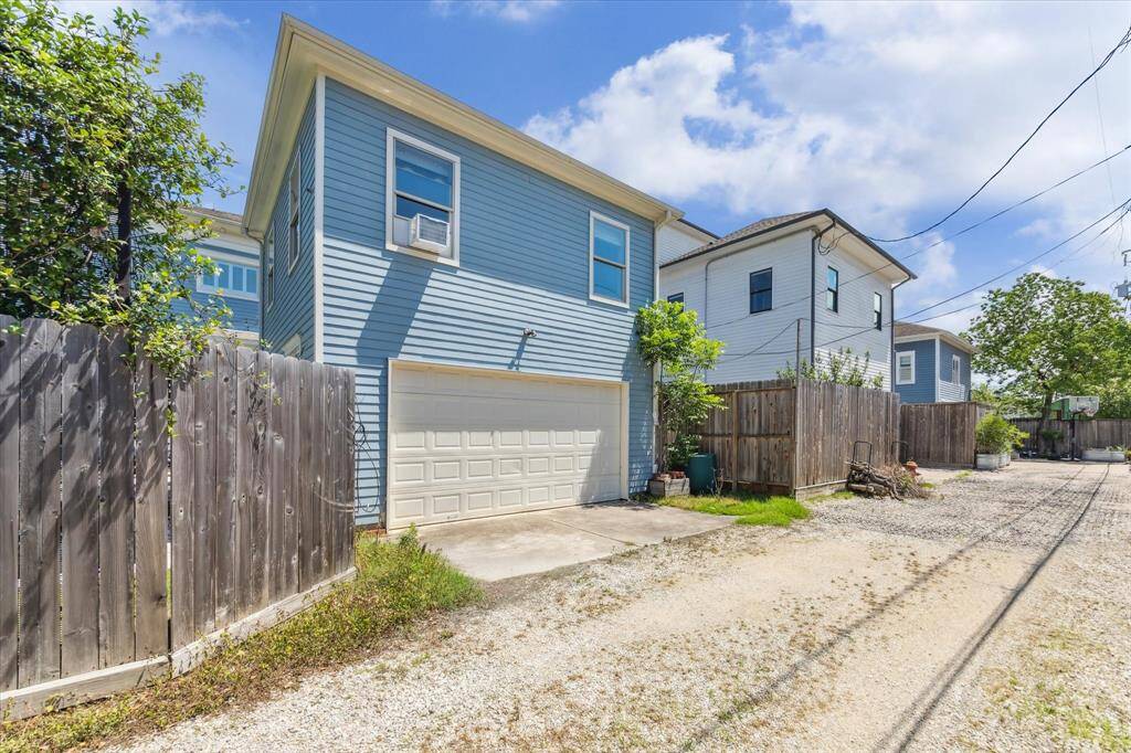 Convenient Rear Garage Access: This property offers a spacious two-car garage with direct alley access, ensuring secure parking and easy entry. The private fenced yard and additional storage space enhance both functionality and privacy.