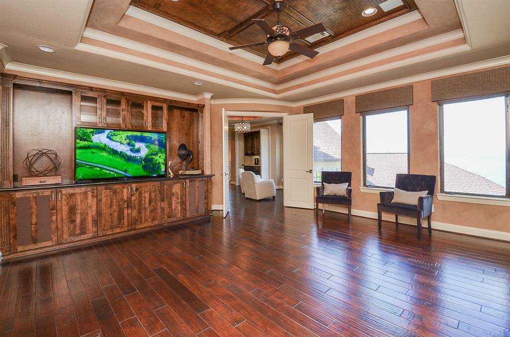 Another angle of the upstairs family room is an integral part of the owner's suite, elevating the overall sense of opulence and coziness.