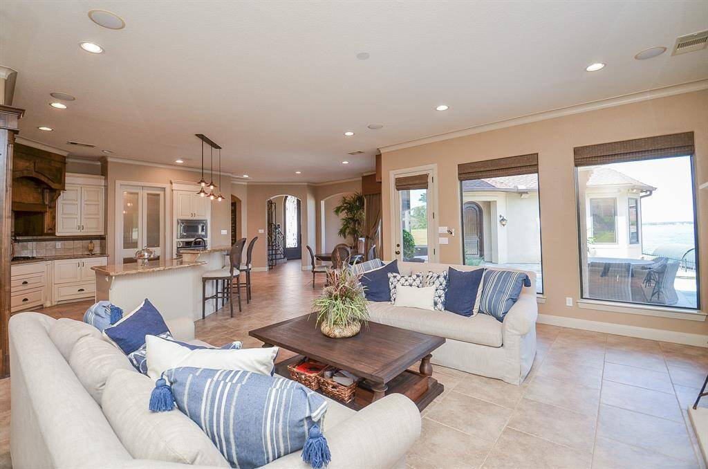 Another image highlights the open floor plan, including the kitchen, living area, and breakfast space. The generous living area comfortably accommodates two sleeper sofas, as seen in the picture.