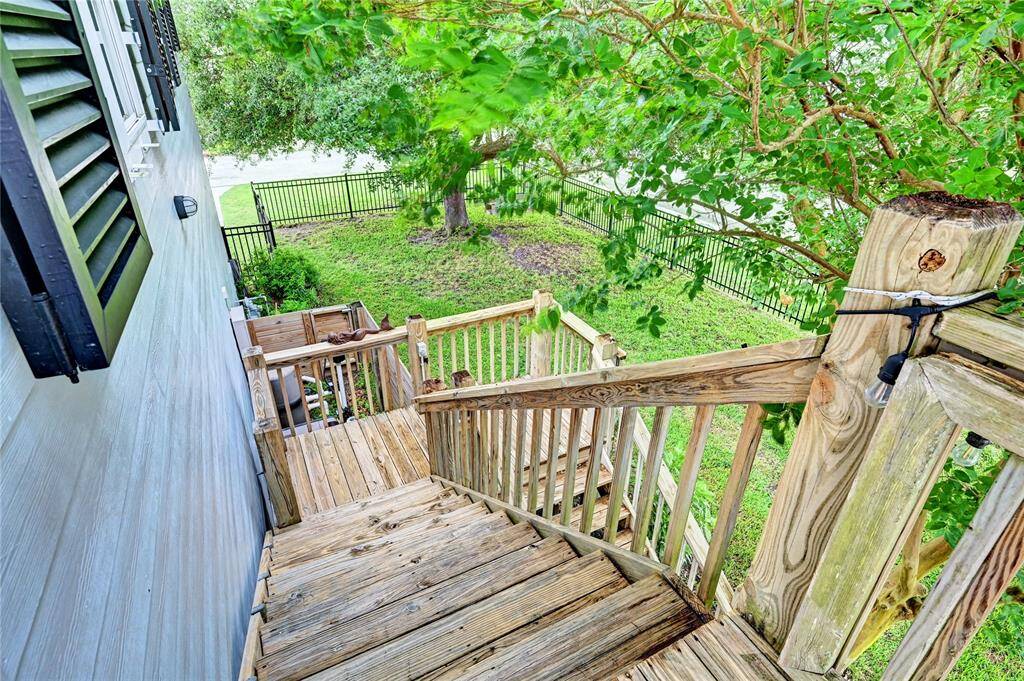 Rear stairs to the pool and patio area