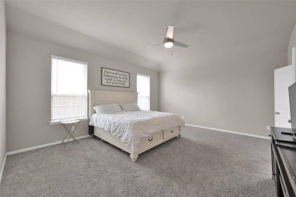 A large and welcoming aesthetic for this Master Bedroom in the back of the home for privacy.
