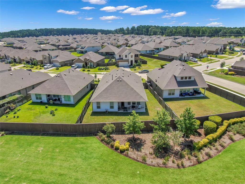 Well maintained green space outside of back fence.