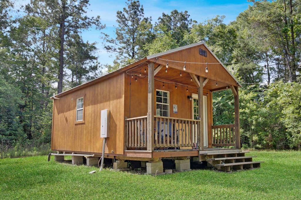 East cabin right at the fork. Tucked into the trees, perfect for short-term rentals or a private retreat.
