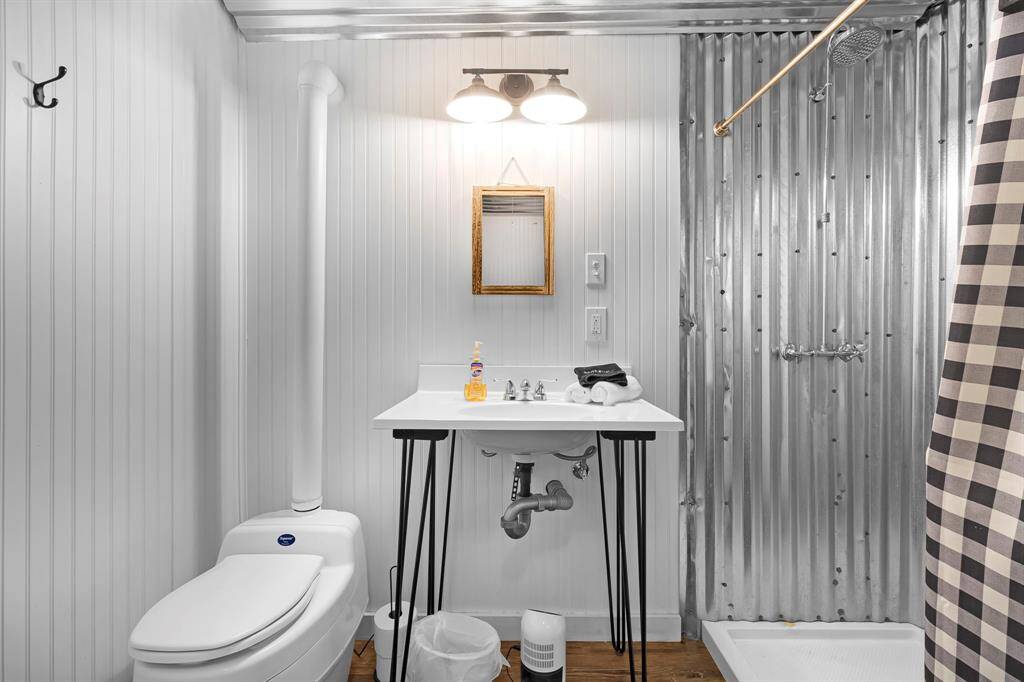 Stylish and functional bathroom with modern plumbing and a composting toilet.