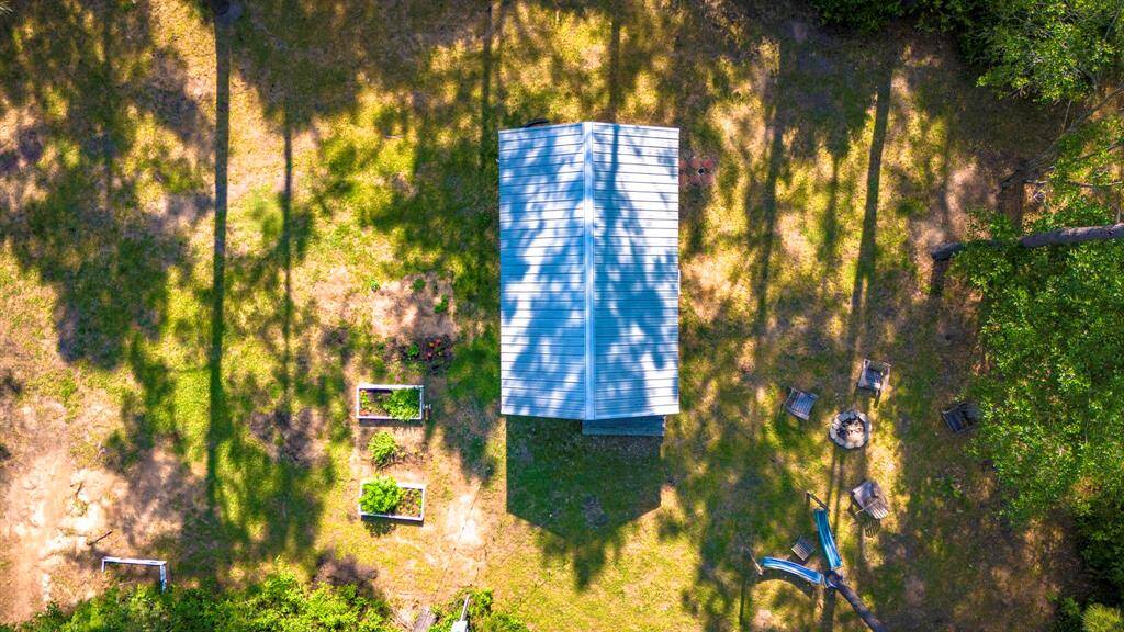 West cabin with herb gardens and outdoor lounge area.