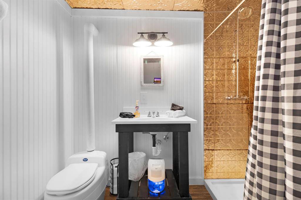 Stylish and functional bathroom with with modern plumbing and a composting toilet.