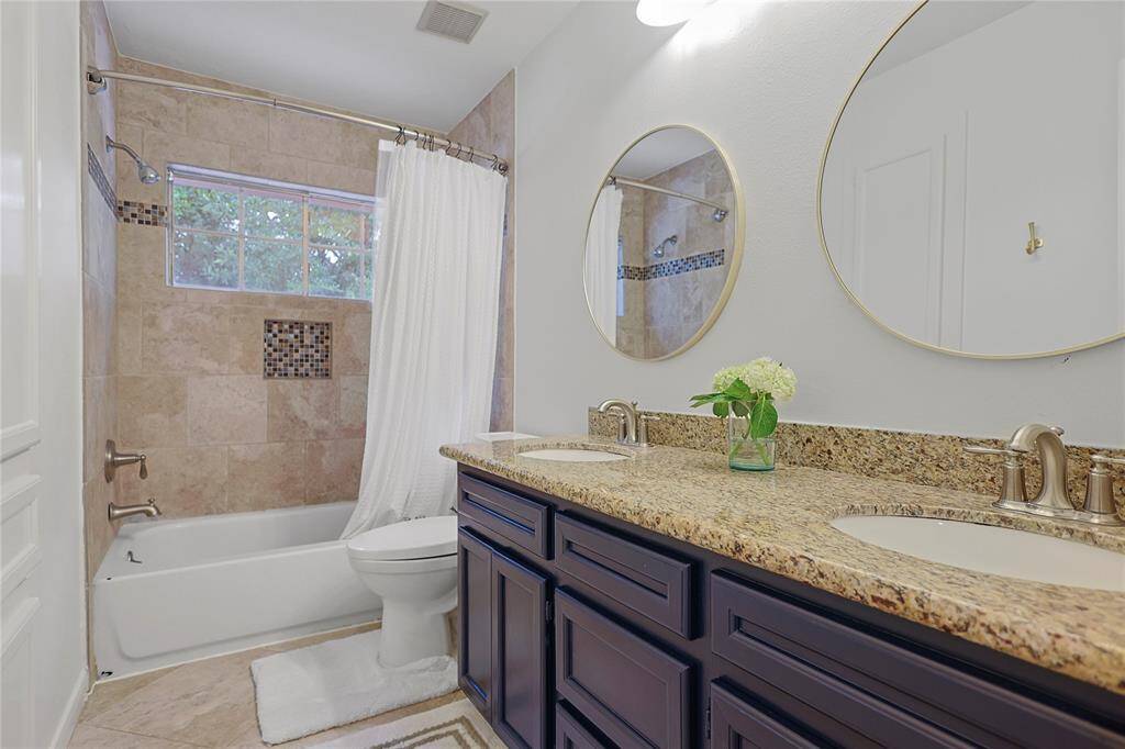 Secondary bathroom features atub/shower combo and long vanitywith plenty of counter space.