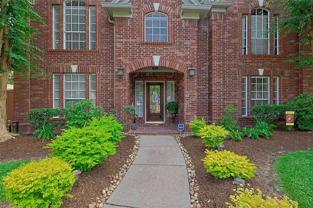 Approaching the front door you willsee the brick elevation, covered frontporch, and lovely landscaping.