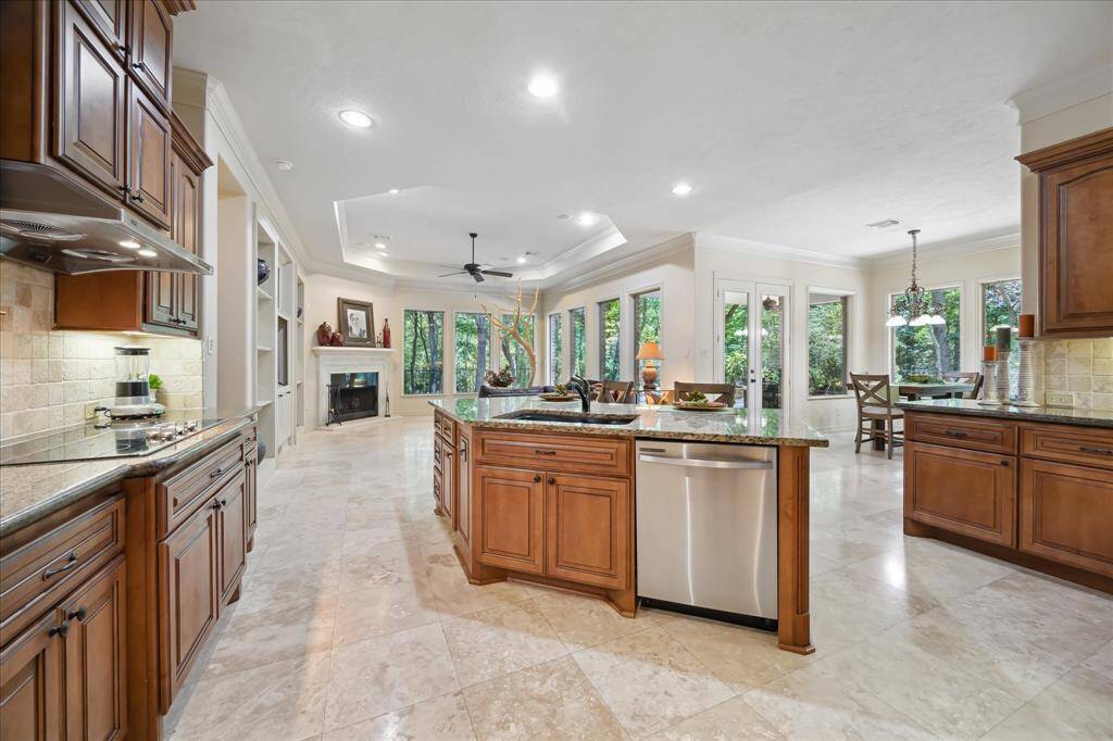 The open-concept design seamlessly connects the living area to the kitchen and dining spaces—perfect for entertaining or everyday comfort.