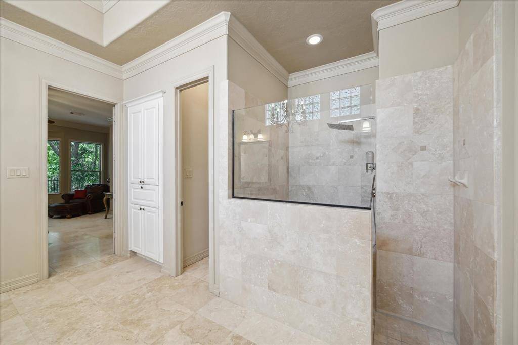 Thoughtfully designed with ample space, this serene bath includes dual vanities and a large, separate walk-in shower with elegant finishes.