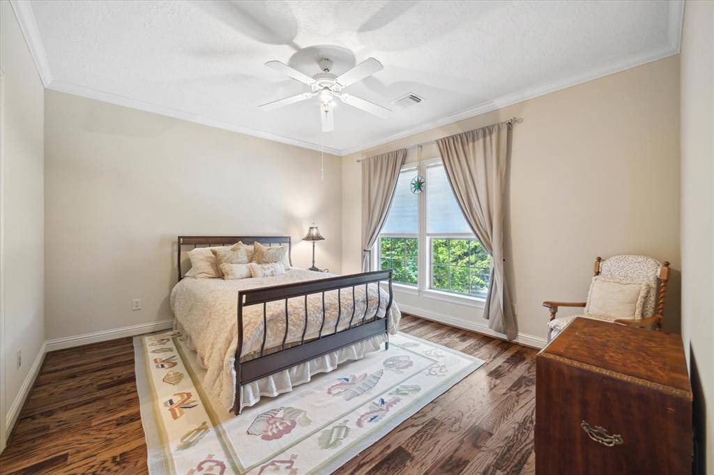 This secondary bedroom is a true retreat, offering the added convenience of its own private bathroom.