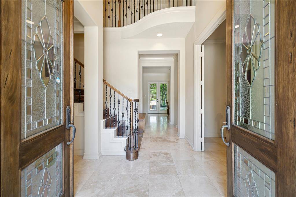 Step inside through impressive double front doors to a light-filled, open-concept floor plan.