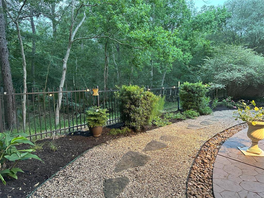 A rock pathway adds charm and low-maintenance appeal to the yard, but can easily be converted back to grass, making it a great option for pet owners or those who prefer a lawn.