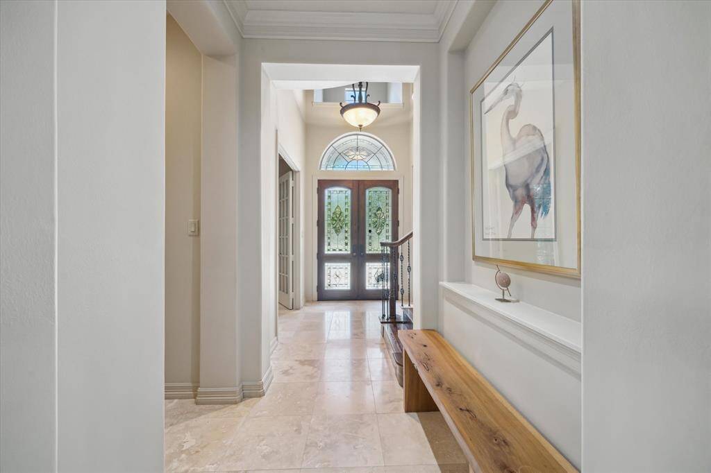 Enjoy the timeless elegance of travertine floors that flow seamlessly throughout the entire first floor.