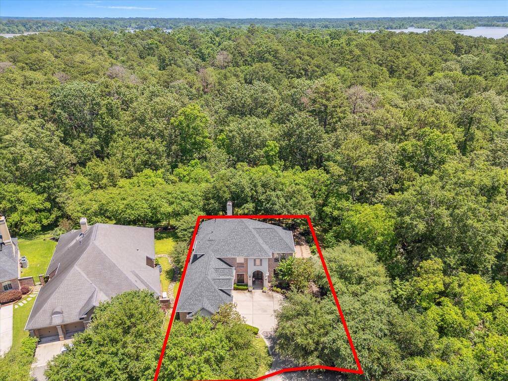 Enjoy unmatched privacy with no back neighbors and a breathtaking backdrop of 300 acres of wooded preserve stretching all the way to Lake Houston.