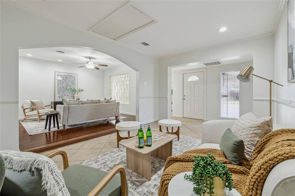 This cozy den provides a versatile additional living area, perfect for a playroom, home office, or media space. Windows and recessed lighting keep the space bright and inviting.