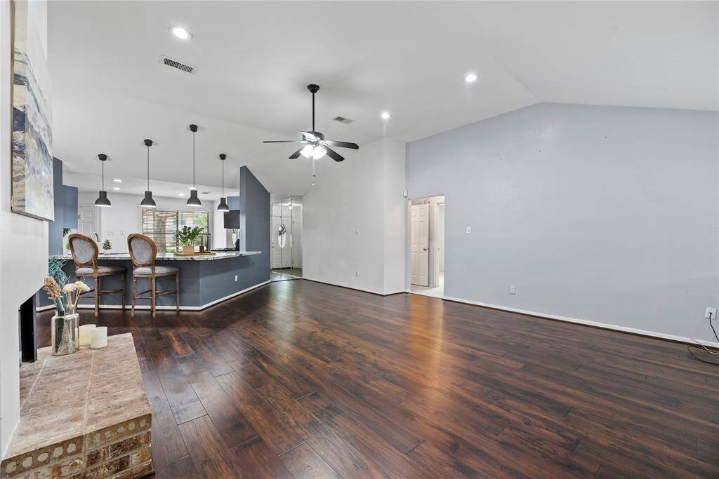 Spacious living room with engineered hardwood floors and open concpet living space.