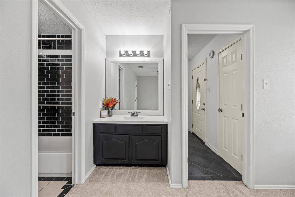 One of two vanity spaces in the secondary bathroom.