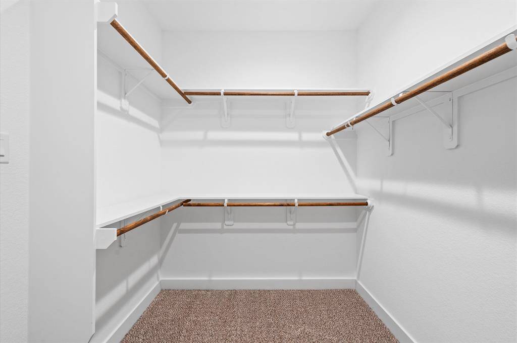 The spacious primary closet offers you a dedicated space to showcase your capsule wardrobe of the season, or the entire collection (including those sentimental garments we all keep hidden in the back). Plush carpeting, wide baseboards and great lighting make this a space you want to be in to get dressed everyday!