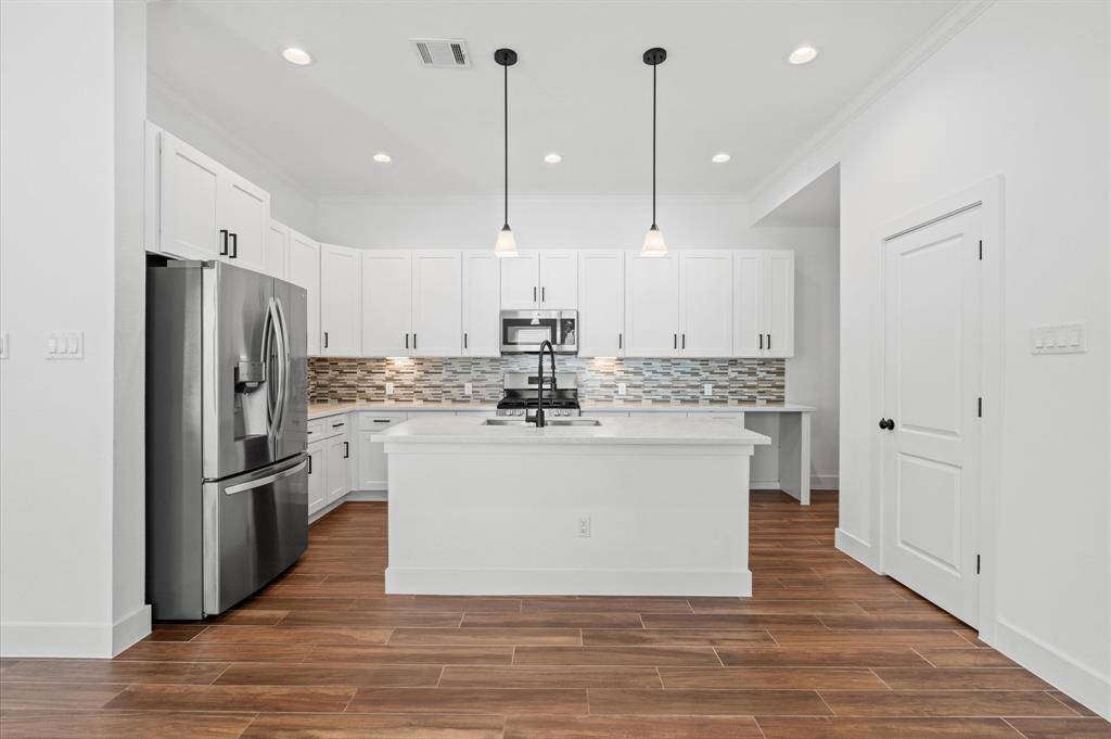 Welcome home to 13415 Scott Street, where pride of ownership shines throughout! This beautifully maintained home features 3 bedrooms, 2.5 bathrooms, and a versatile flex space to suit your needs. A spacious two-car garage with a hardwired EV Charger, and a private driveway complete this exceptional home!