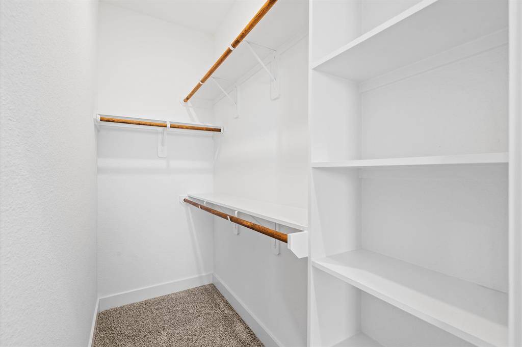 Housed inside one of the secondary bedrooms, this closet offers built-in and hanging solutions for the perfect organization set-up of clothing, shoes, or to display your favorite items!