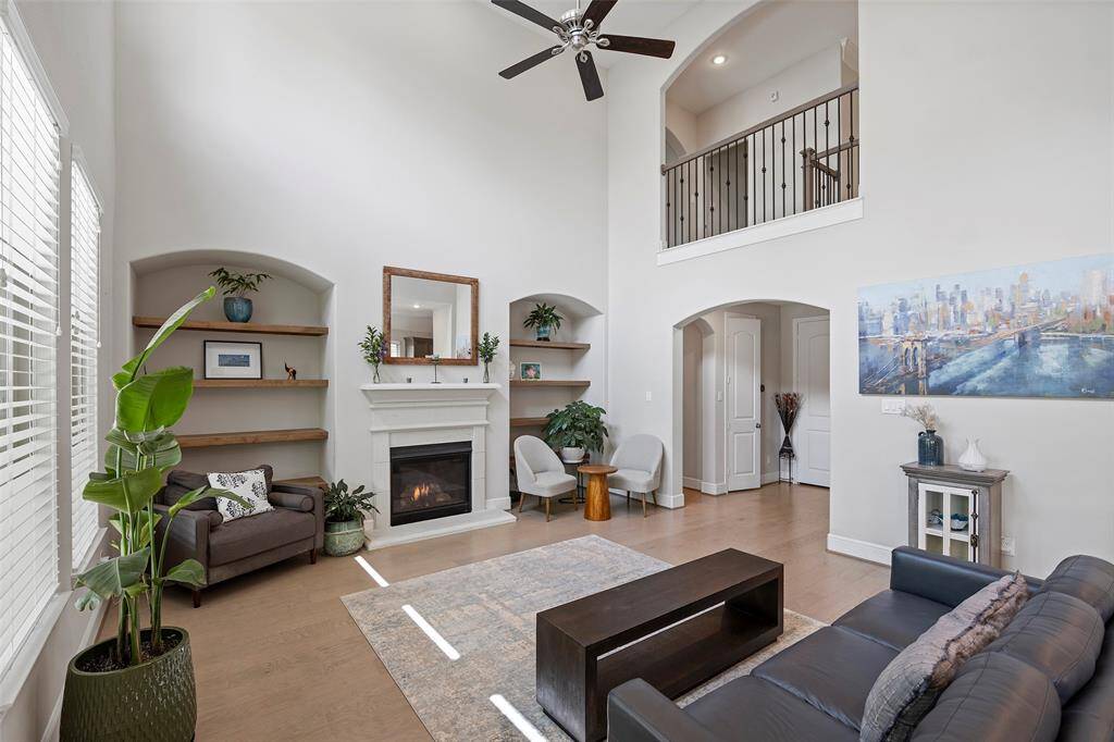 Don't miss the custom shelving on either side of the gas log fireplace.