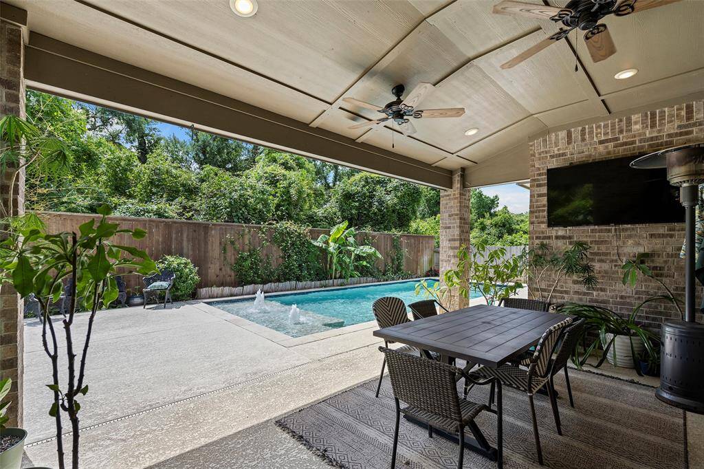 Step outside to your private backyard oasis with a covered patio and sparkling pool!