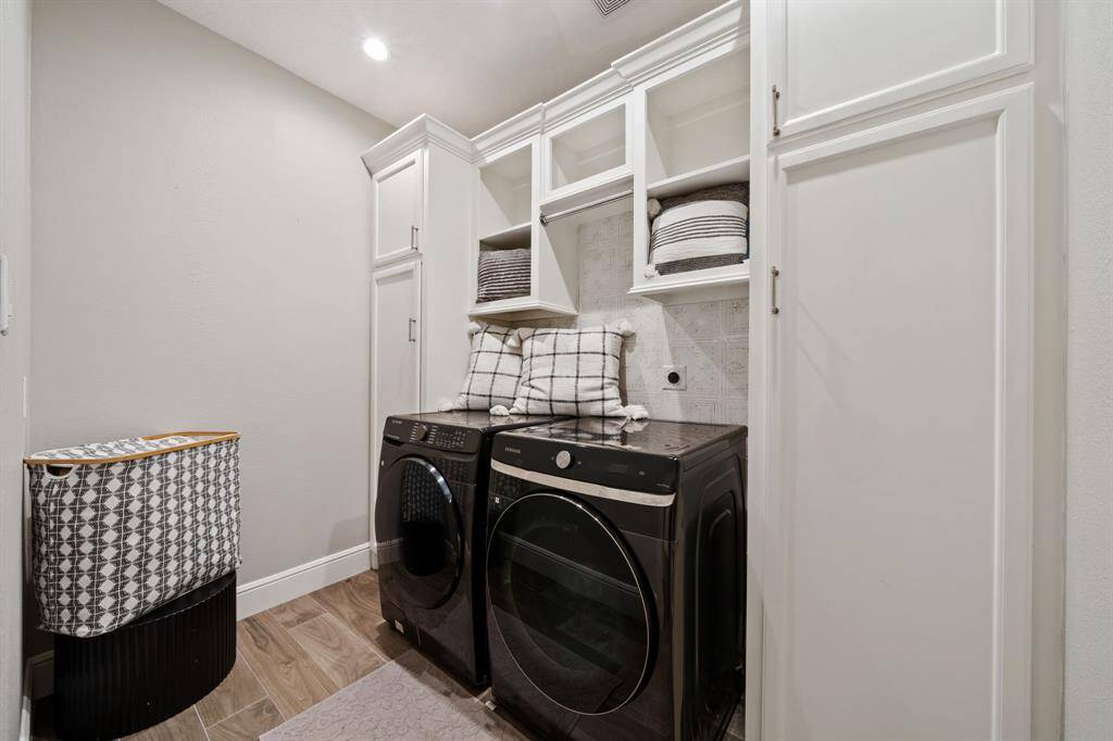 Fantastic laundry room with loads of storage.