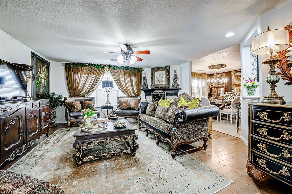 The large living room flows seamlessly into the beautifully updated kitchen and dining area, creating a space that feels both modern and warm.