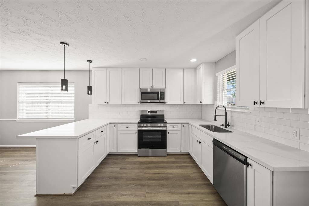 Kitchen completely updated with new cabinets, quarters countertop, and stainless appliances