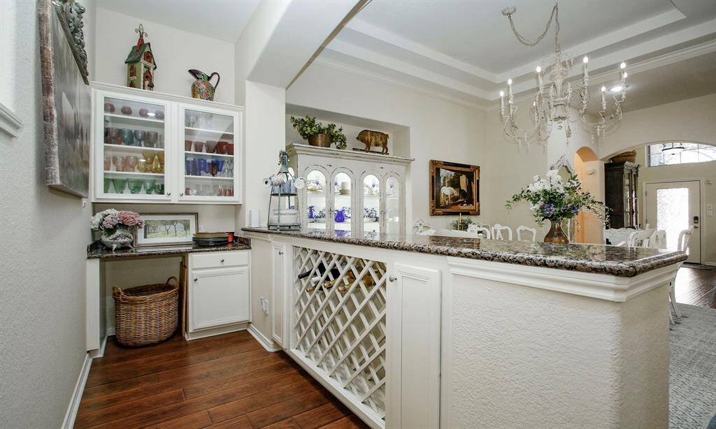 Dry bar with storage and serving area.