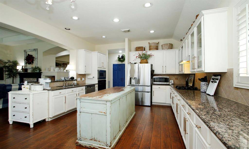 The blue door leads to your big pantry with ample shelving.